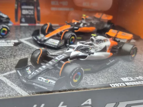 Set McLaren F1 - #4 Lando Norris - GP-ul Marii Britanii 2023 - GP-ul Singapore 2023 - GP-ul Monaco 2023 - Abu Dhabi 2022 - Bburago - 1:43