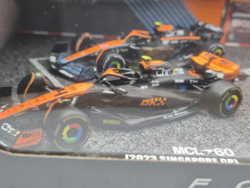 Set McLaren F1 - #4 Lando Norris - GP-ul Marii Britanii 2023 - GP-ul Singapore 2023 - GP-ul Monaco 2023 - Abu Dhabi 2022 - Bburago - 1:43